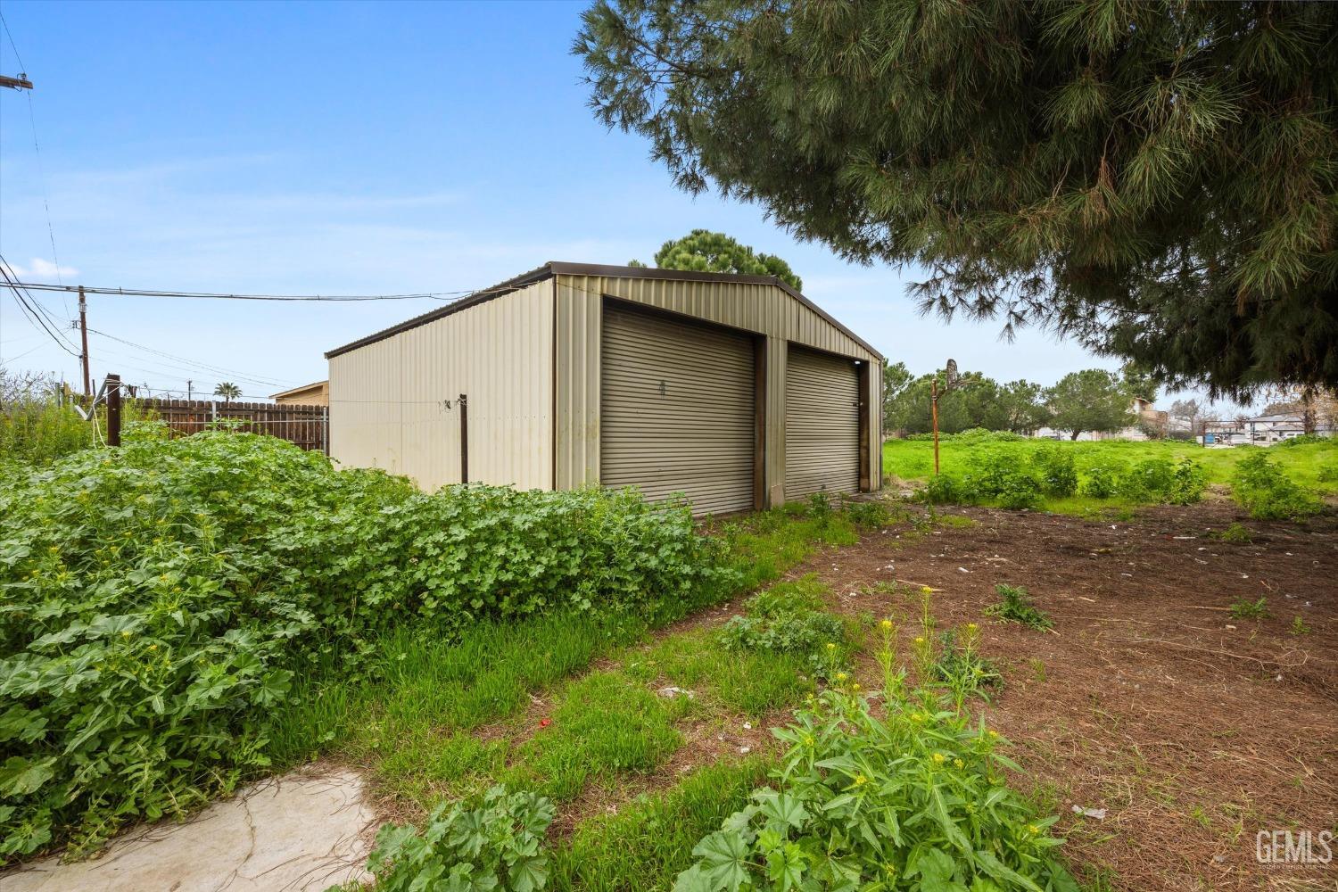 Undisclosed Address Bakersfield, CA 93308 - Photo 29 of 50 a view of a house with a yard
