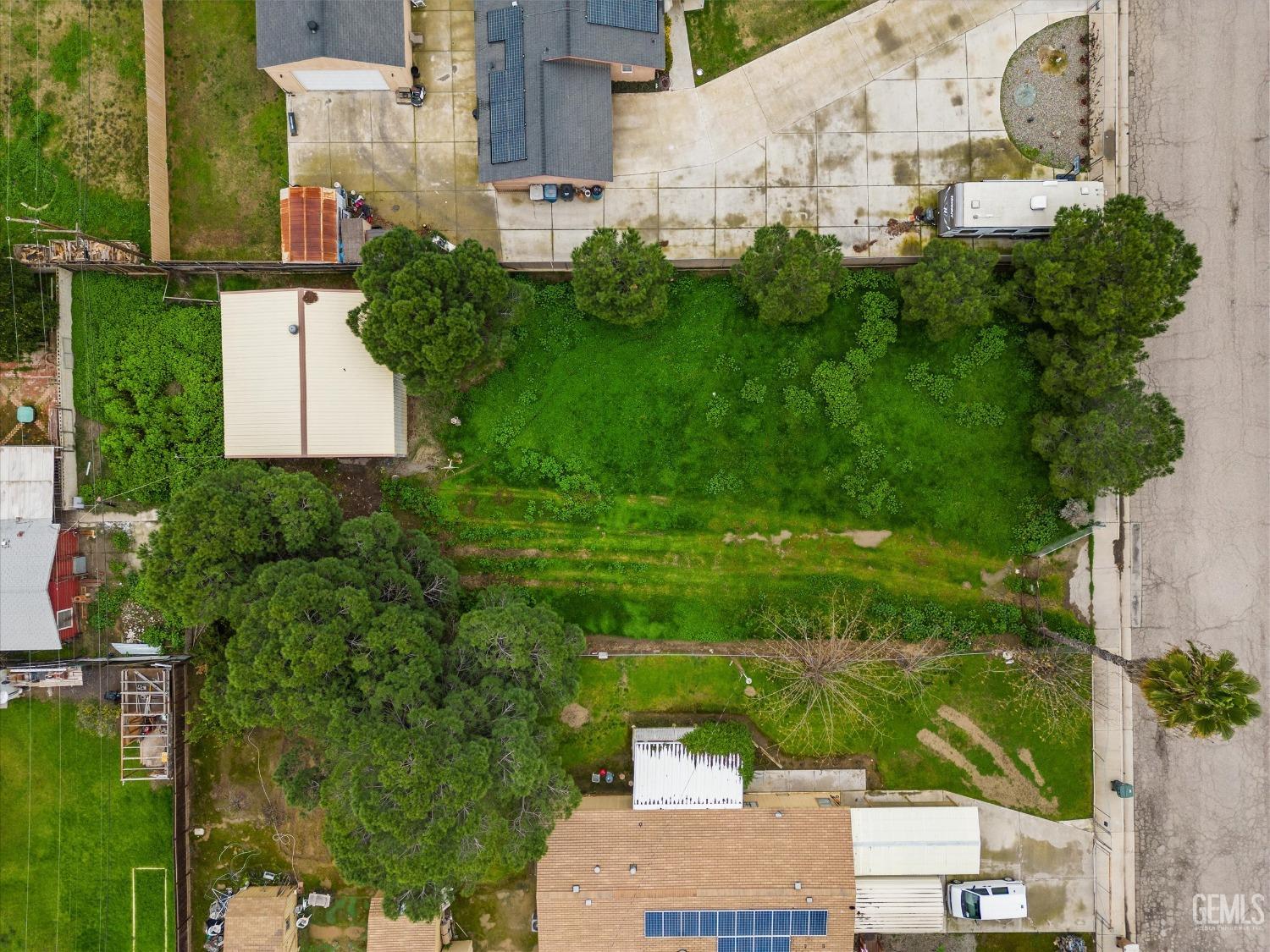 Undisclosed Address Bakersfield, CA 93308 - Photo 31 of 50 an aerial view of residential houses with outdoor space and trees
