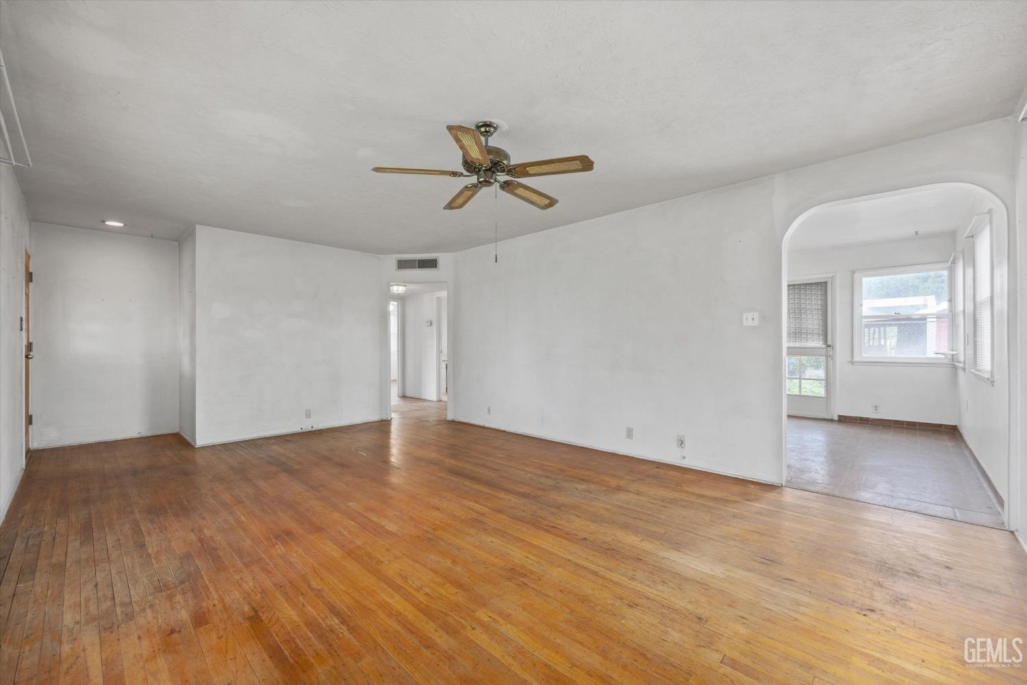 Undisclosed Address Bakersfield, CA 93308 - Photo 8 of 50 an empty room with fan and windows