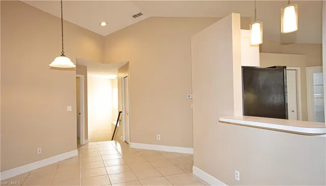 a view of a hallway with a ceiling fan