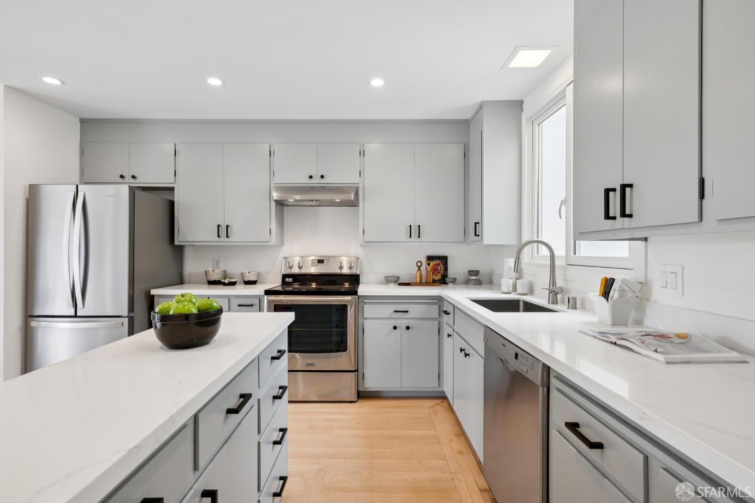 1983 10th Avenue San Francisco, CA 94116 - Photo 15 of 32 a kitchen with a sink and white appliances