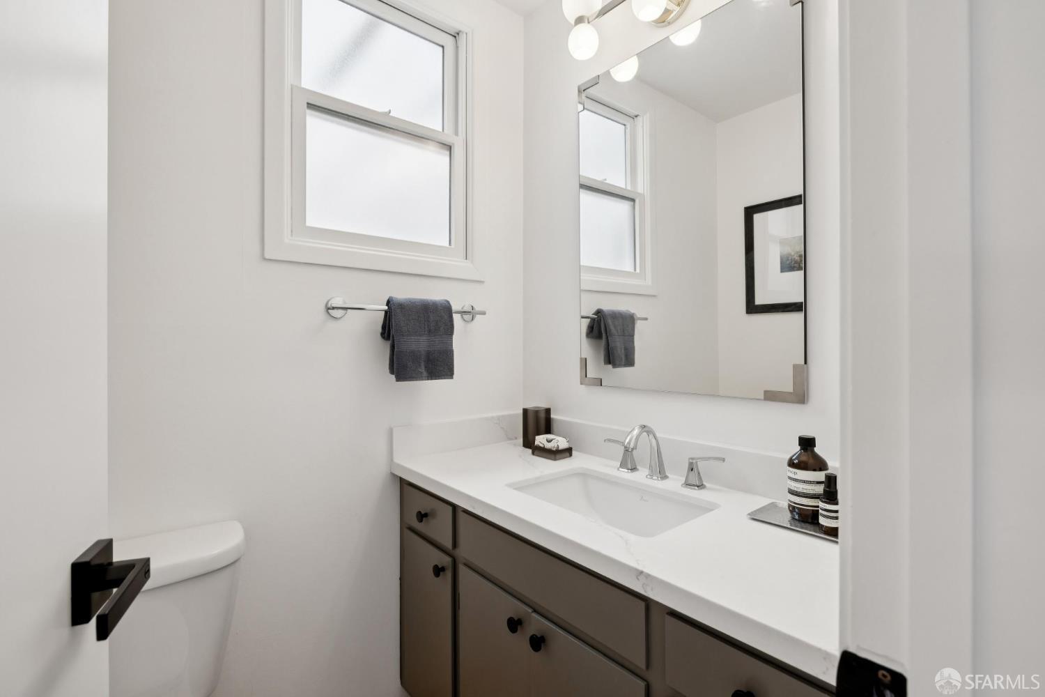 1983 10th Avenue San Francisco, CA 94116 - Photo 20 of 32 a bathroom with a sink and a mirror