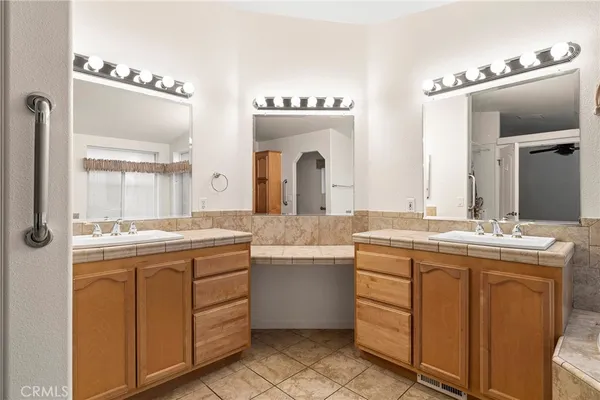 a white bath tub sitting in a bathroom next to a window