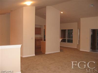 1900 West 13th Street Lehigh Acres, FL 33972 - Photo 2 of 10 a view of an empty room with a window