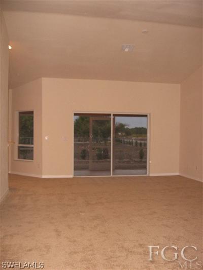 1900 West 13th Street Lehigh Acres, FL 33972 - Photo 5 of 10 a view of an empty room with a fireplace