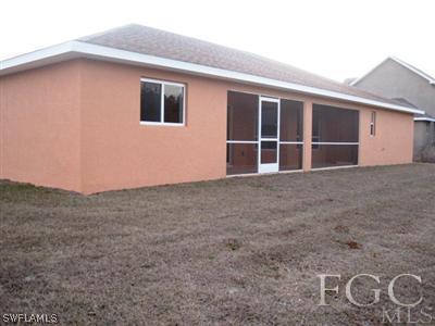 1900 West 13th Street Lehigh Acres, FL 33972 - Photo 10 of 10 a view of an house with backyard