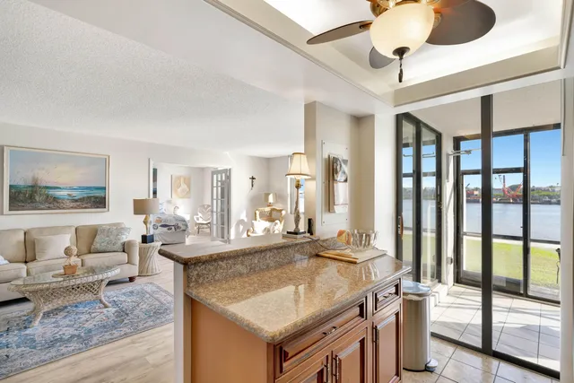 a kitchen with a sink appliances and cabinets