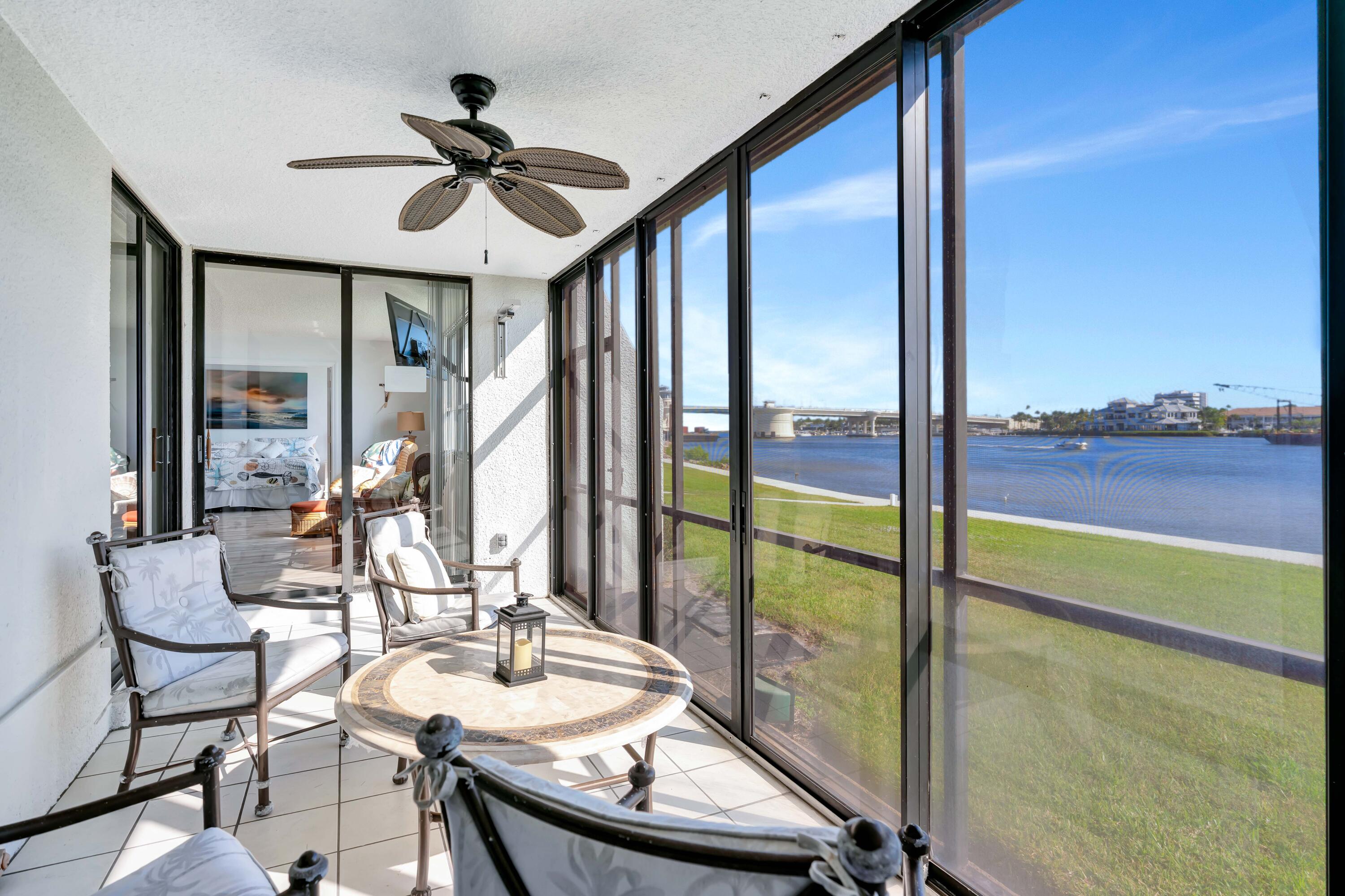 1542 Jupiter Cove Drive, Unit 104 Jupiter, FL 33469 - Photo 20 of 65 a view of a dining room with furniture window and outside view
