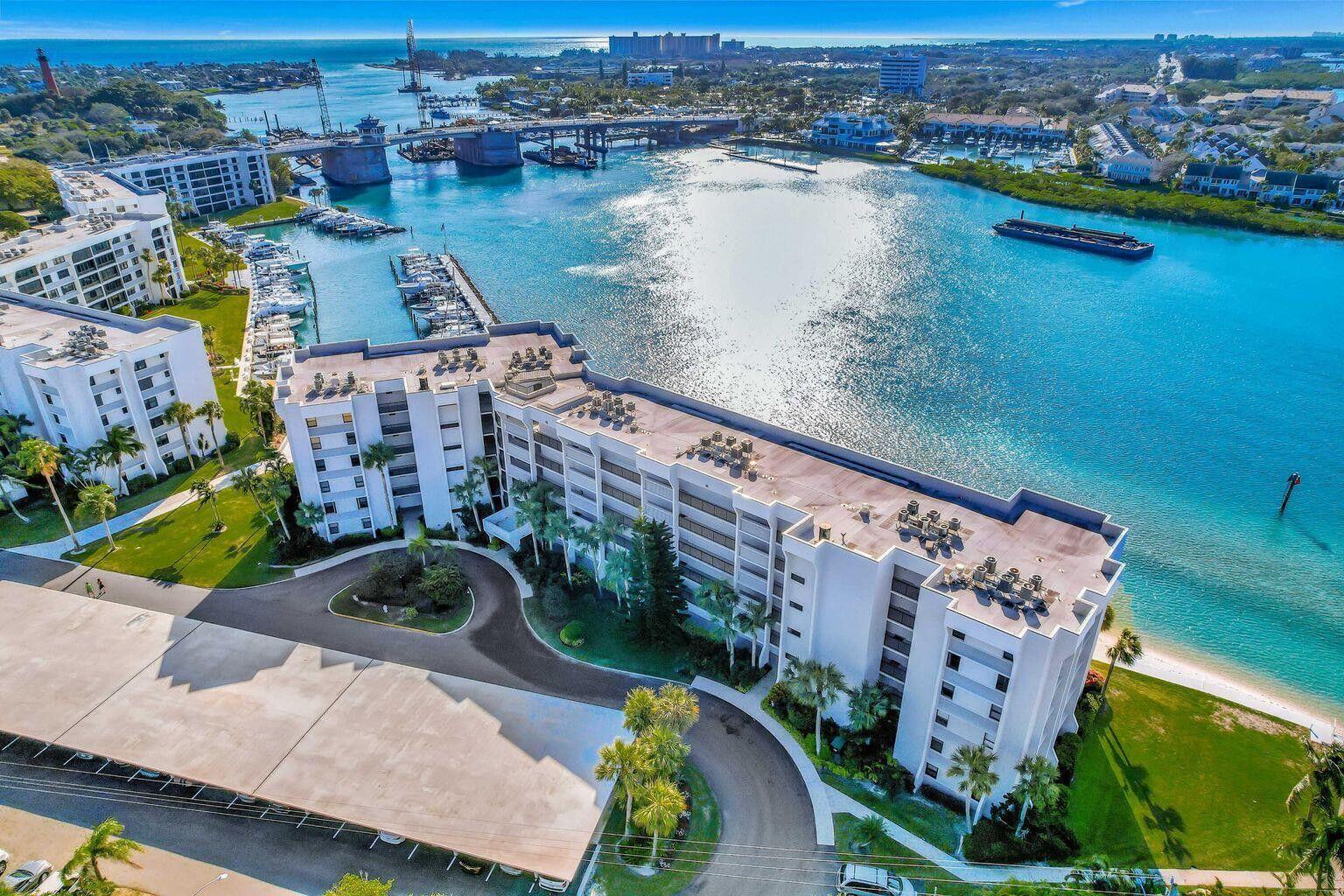 1542 Jupiter Cove Drive, Unit 104 Jupiter, FL 33469 - Photo 23 of 65 an aerial view of a house with a lake view