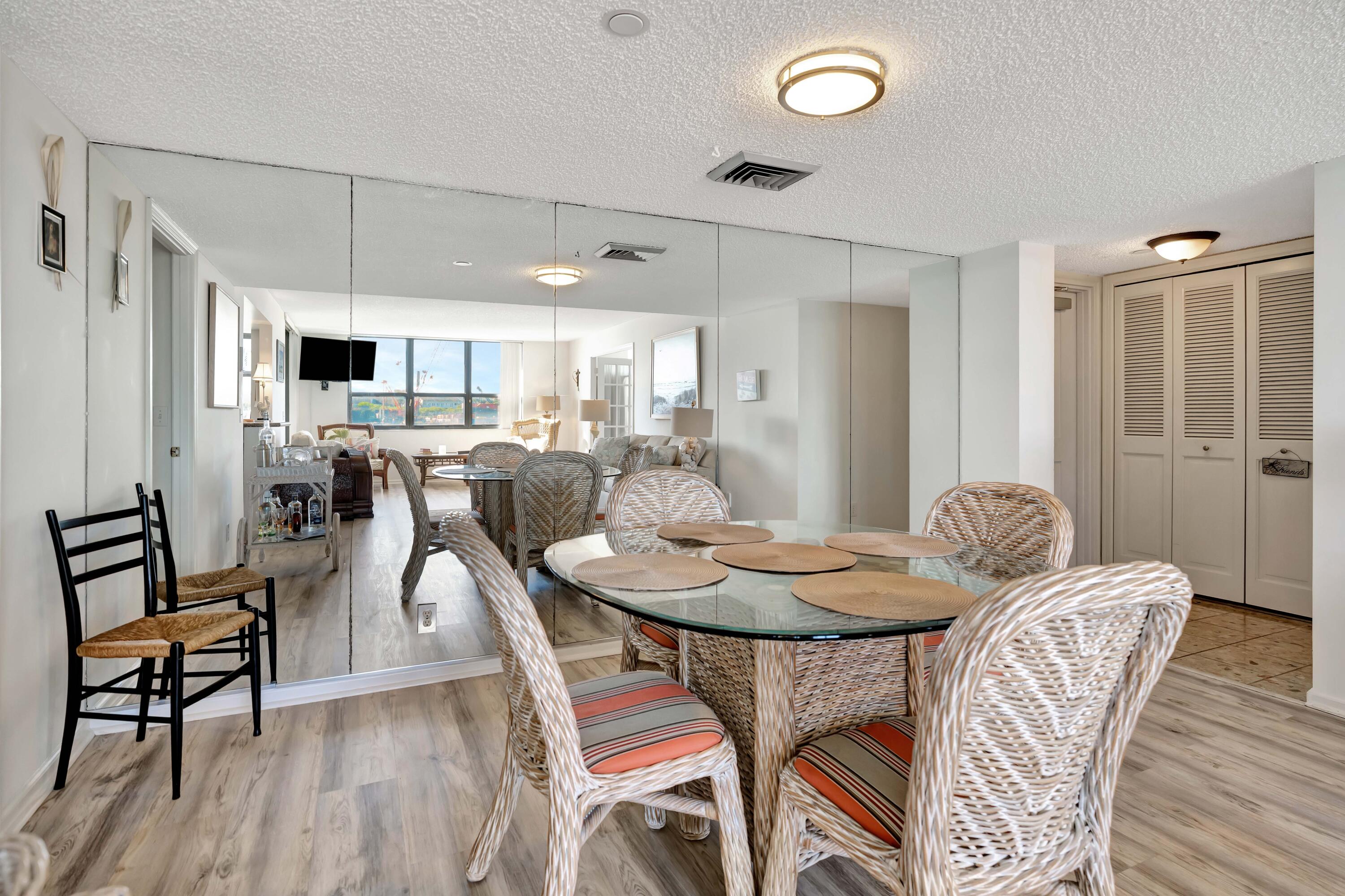 1542 Jupiter Cove Drive, Unit 104 Jupiter, FL 33469 - Photo 25 of 65 a view of a dining room with furniture