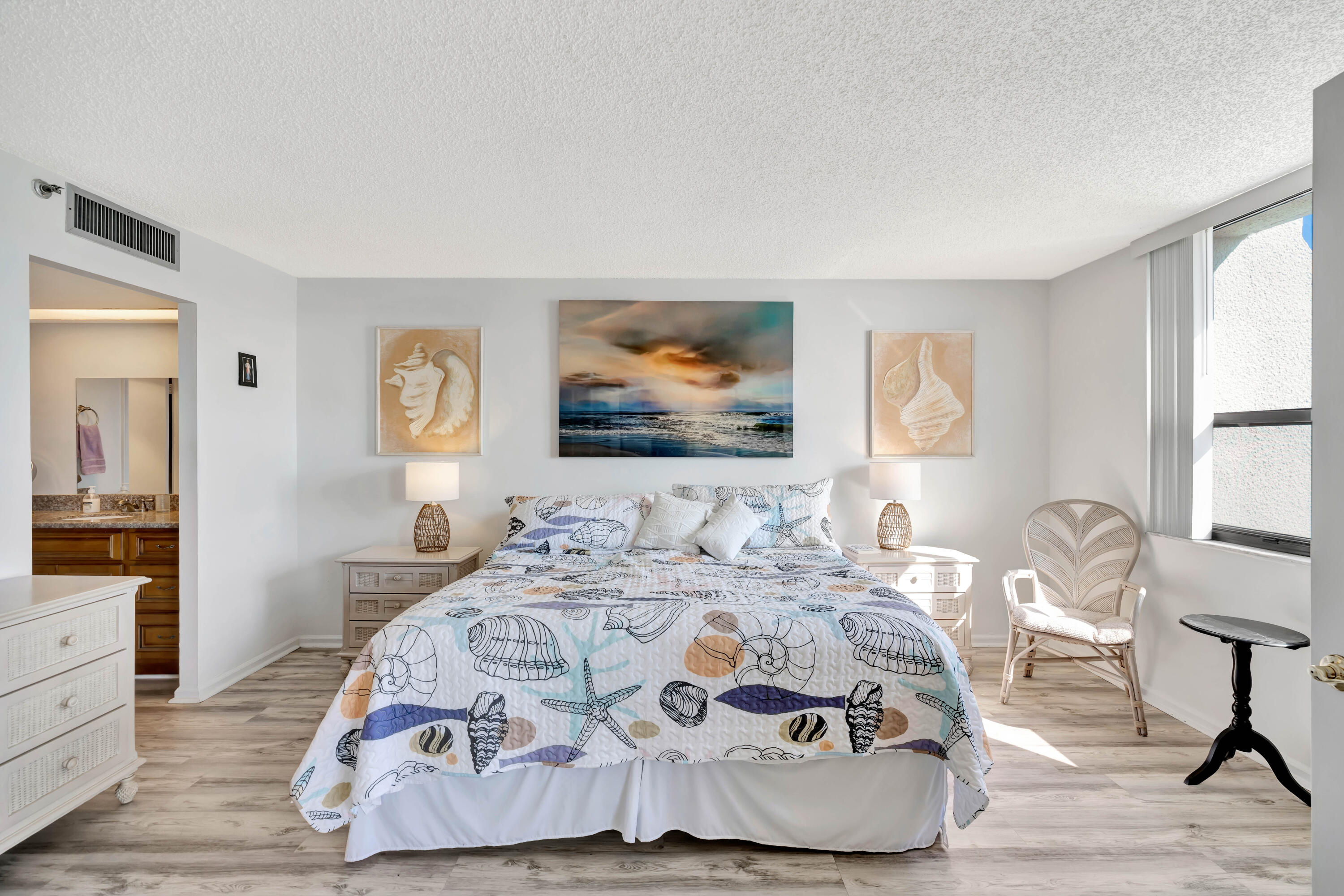1542 Jupiter Cove Drive, Unit 104 Jupiter, FL 33469 - Photo 31 of 65 a bedroom with a bed and wooden floor