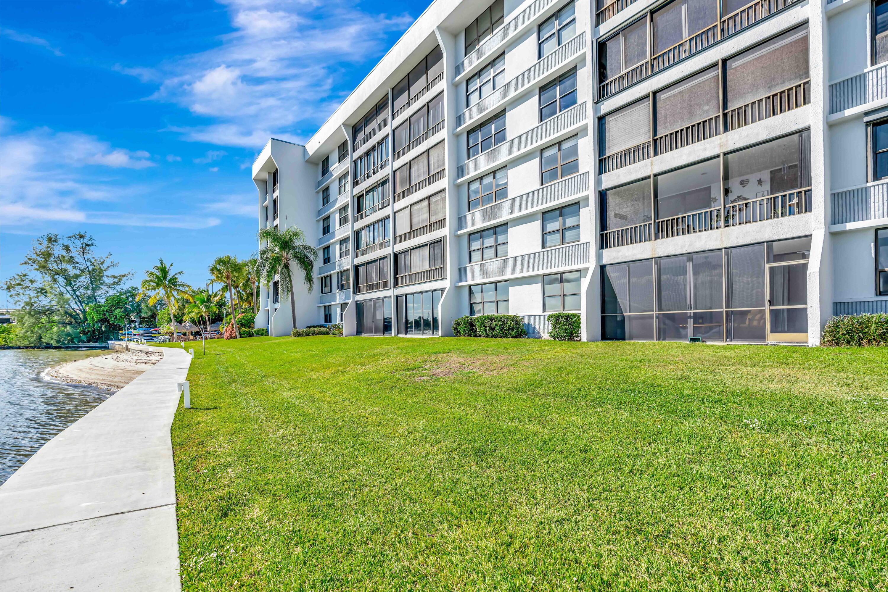 1542 Jupiter Cove Drive, Unit 104 Jupiter, FL 33469 - Photo 36 of 65 a view of building with garden