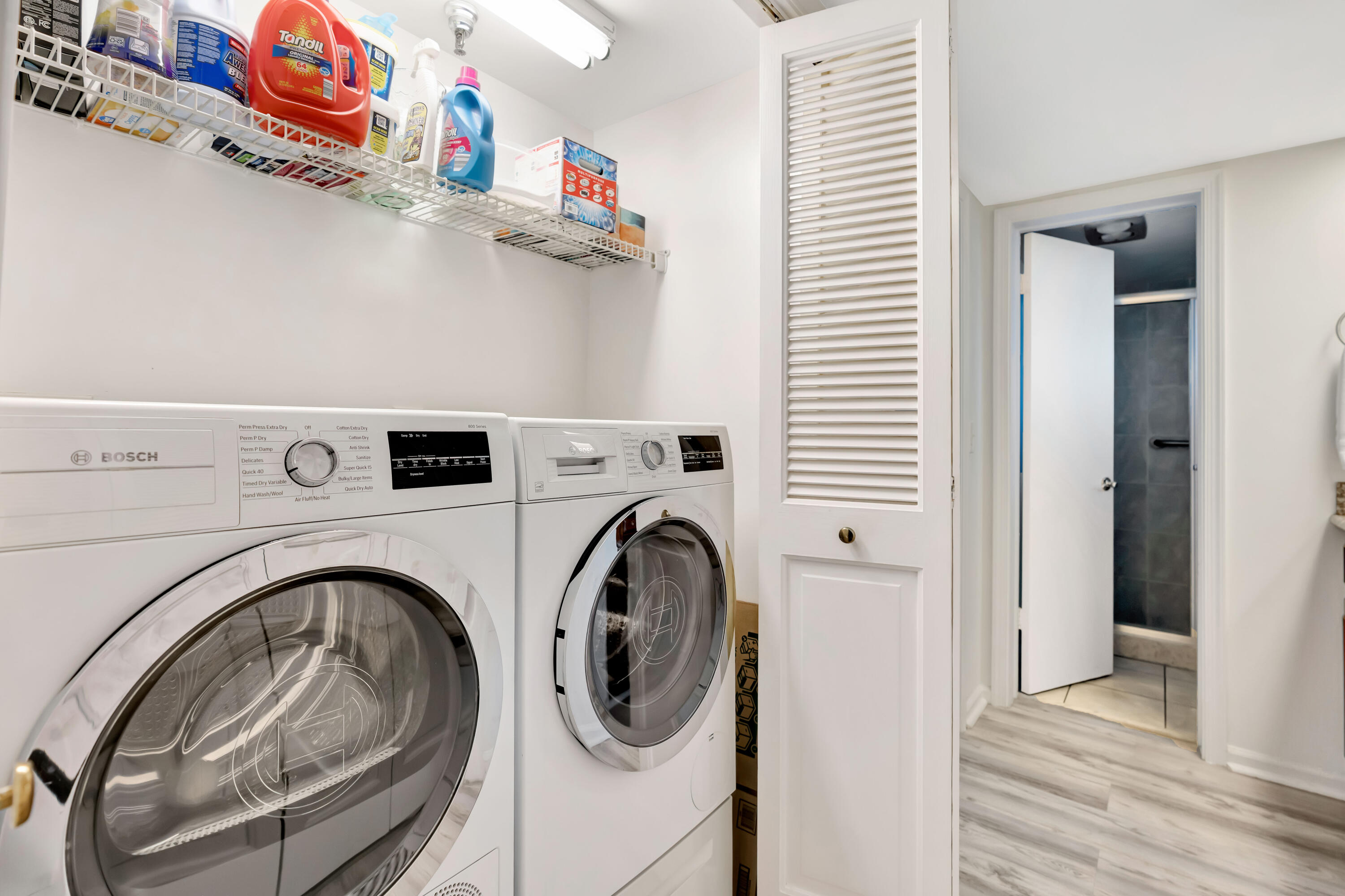 1542 Jupiter Cove Drive, Unit 104 Jupiter, FL 33469 - Photo 43 of 65 a utility room with dryer and washer