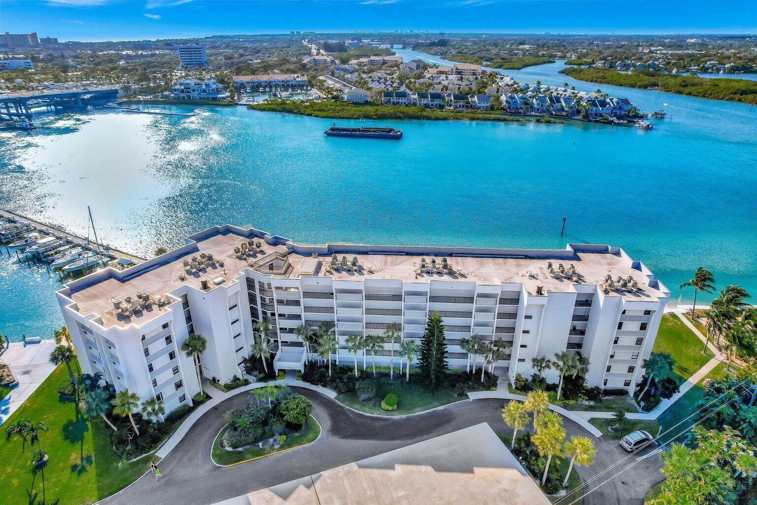 1542 Jupiter Cove Drive, Unit 104 Jupiter, FL 33469 - Photo 50 of 65 an aerial view of a city with ocean view