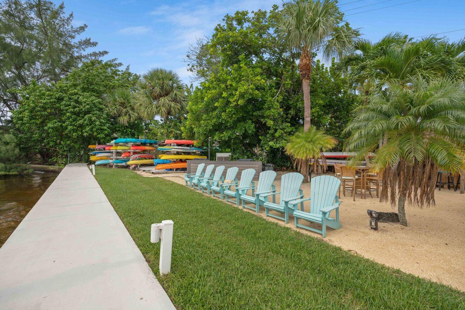 1542 Jupiter Cove Drive, Unit 104 Jupiter, FL 33469 - Photo 55 of 65 a view of a park with swings and slides