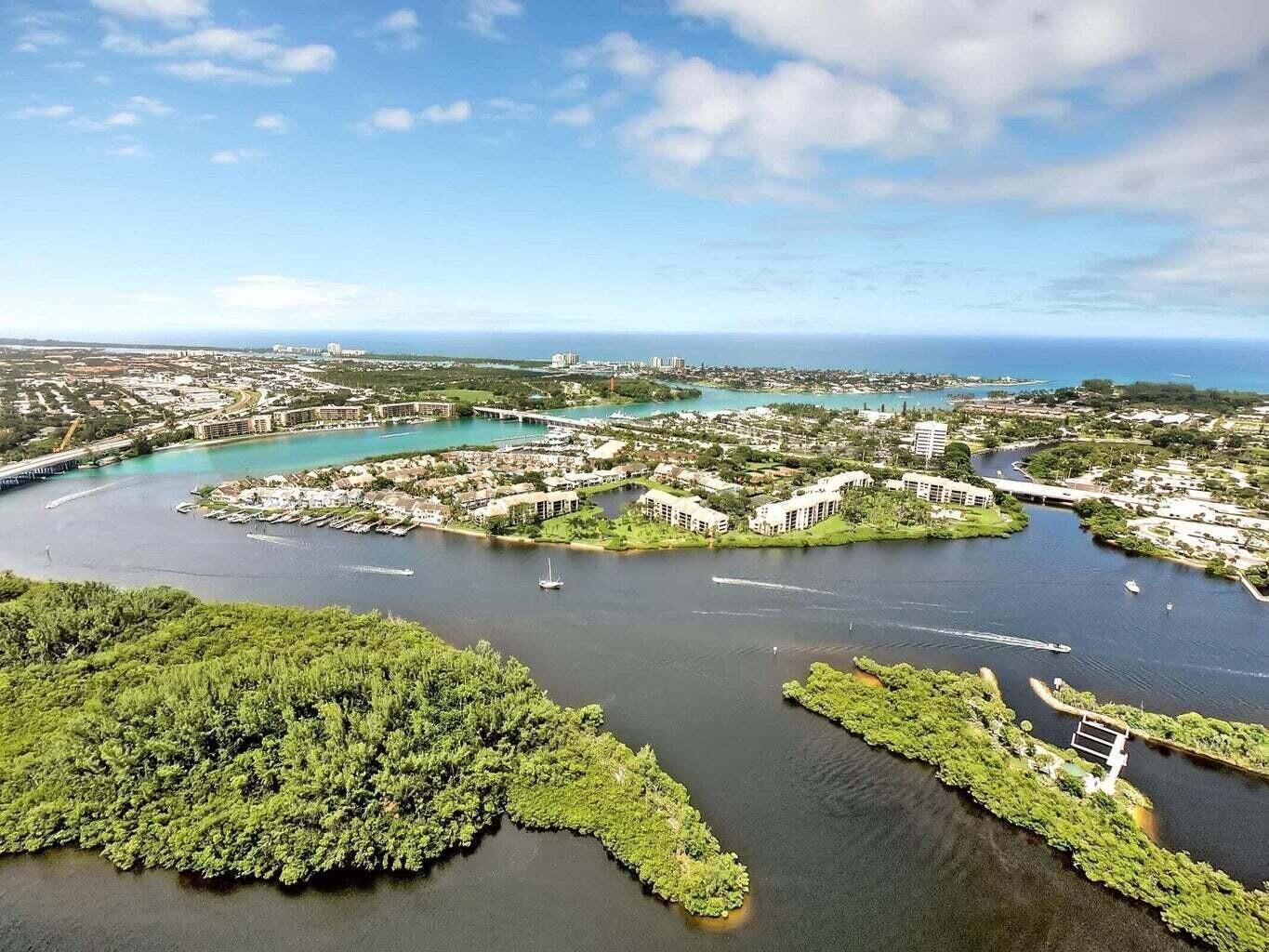 1542 Jupiter Cove Drive, Unit 104 Jupiter, FL 33469 - Photo 64 of 65 a view of a city with an ocean