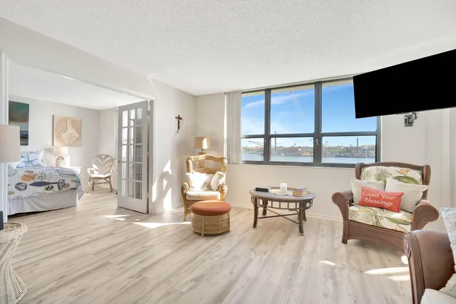 a living room with furniture or couch and a flat screen tv