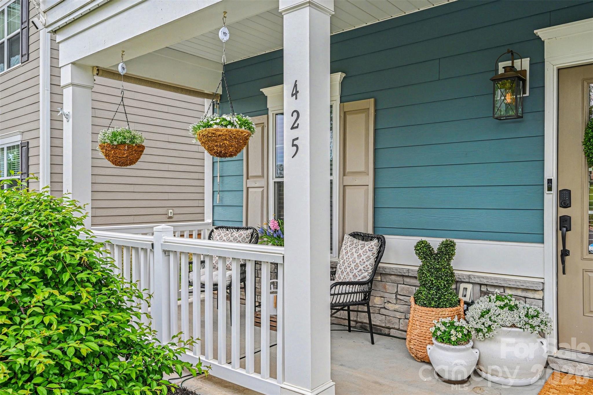 425 Kiser Lane Locust, NC 28097 - Photo 2 of 25 a view of a porch with potted plants