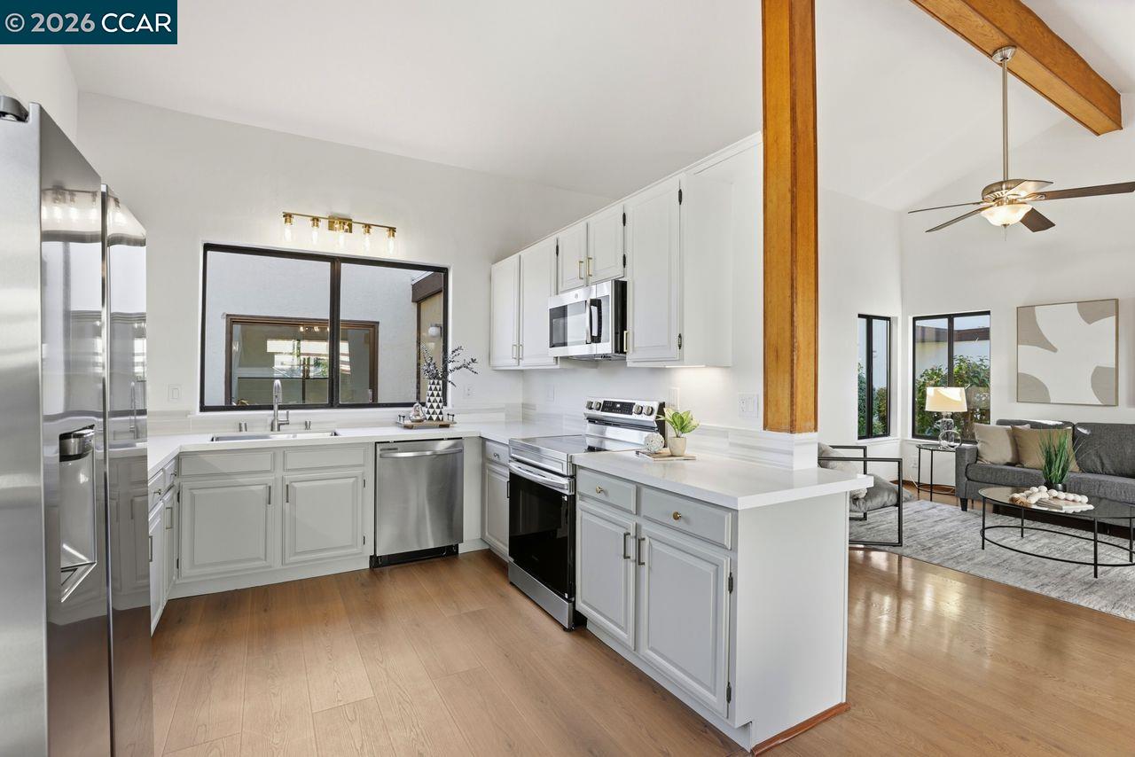 221 Tangerine Court San Ramon, CA 94583 - Photo 11 of 27 a kitchen with a sink stove and cabinets