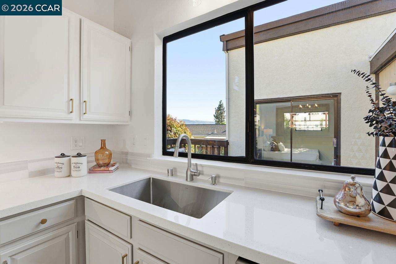 221 Tangerine Court San Ramon, CA 94583 - Photo 13 of 27 a kitchen with a sink cabinets and window