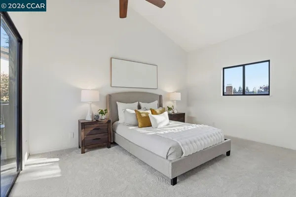 a bedroom with a bed and a night stand