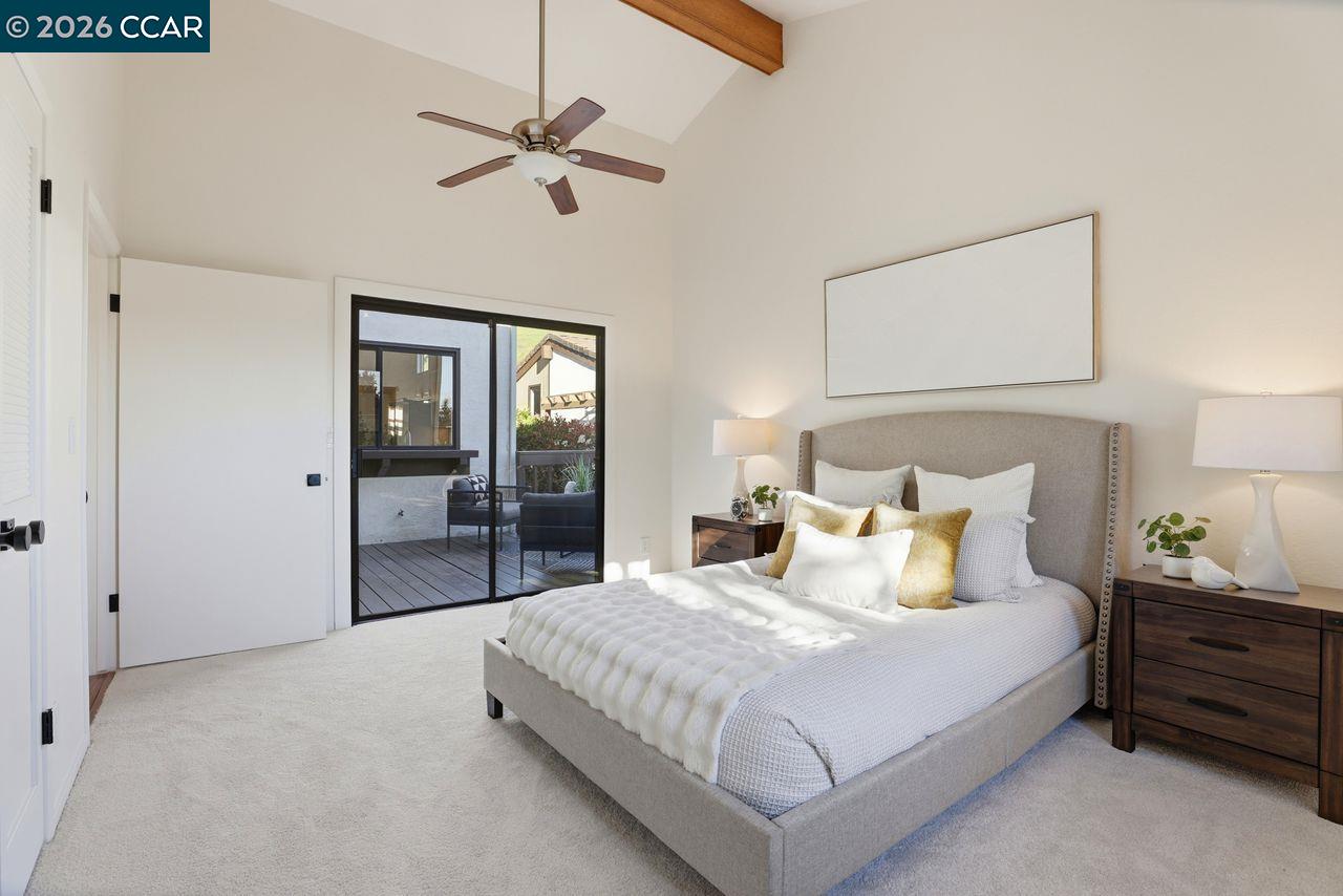 221 Tangerine Court San Ramon, CA 94583 - Photo 17 of 27 a bedroom with a bed and a chandelier