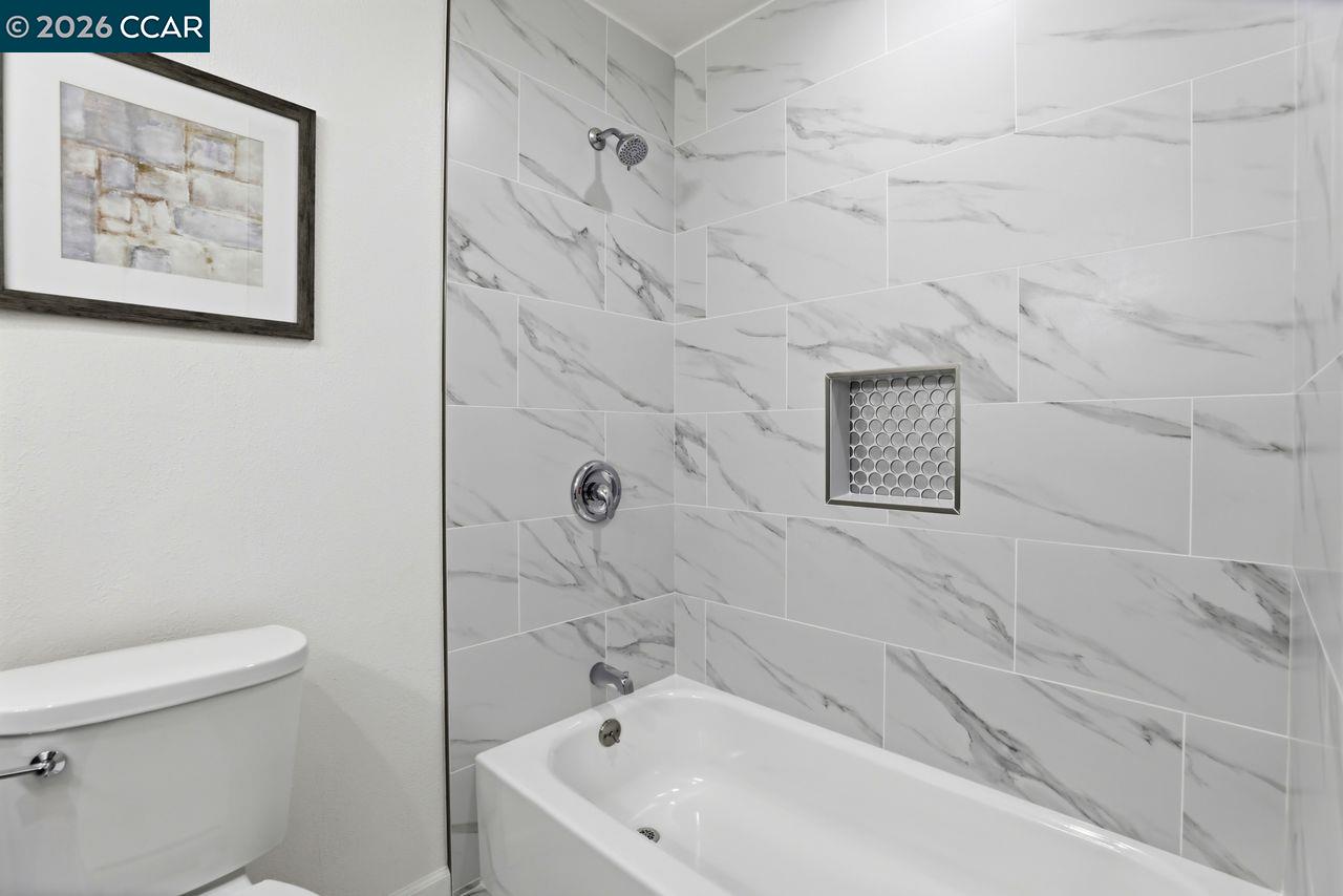 221 Tangerine Court San Ramon, CA 94583 - Photo 22 of 27 a bathroom with a bathtub and a toilet