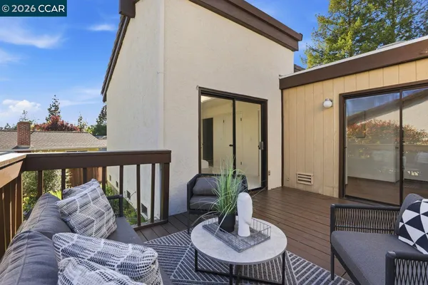 a outdoor living space with furniture and a potted plant