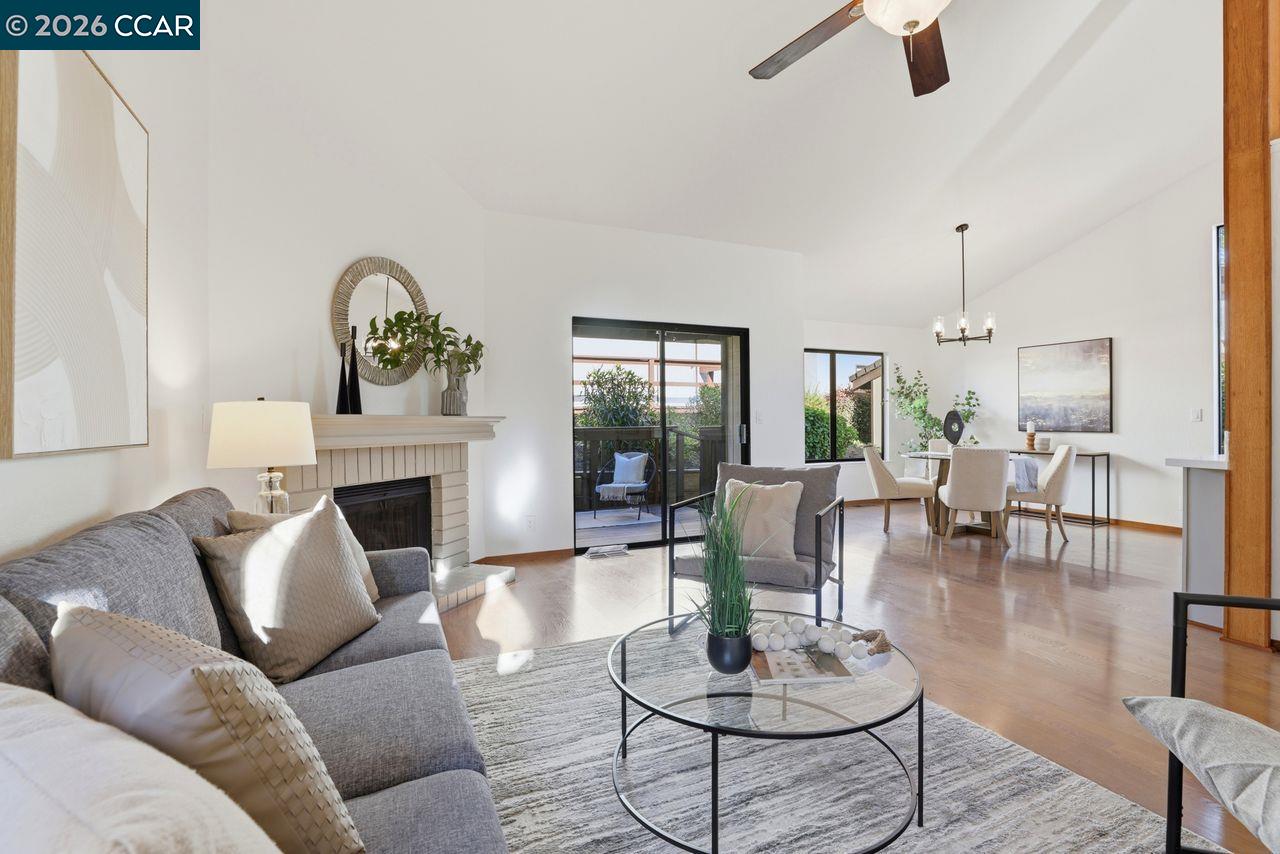 221 Tangerine Court San Ramon, CA 94583 - Photo 7 of 27 a living room with furniture a fireplace and a table