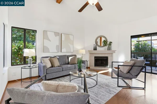 a living room with furniture and a fireplace