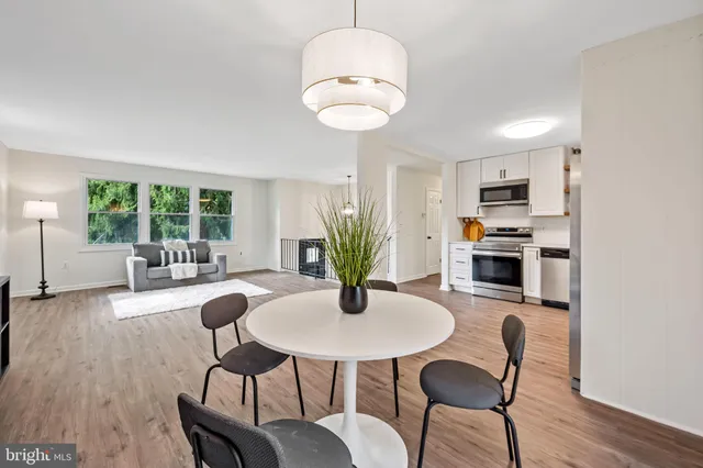 a kitchen with furniture and window