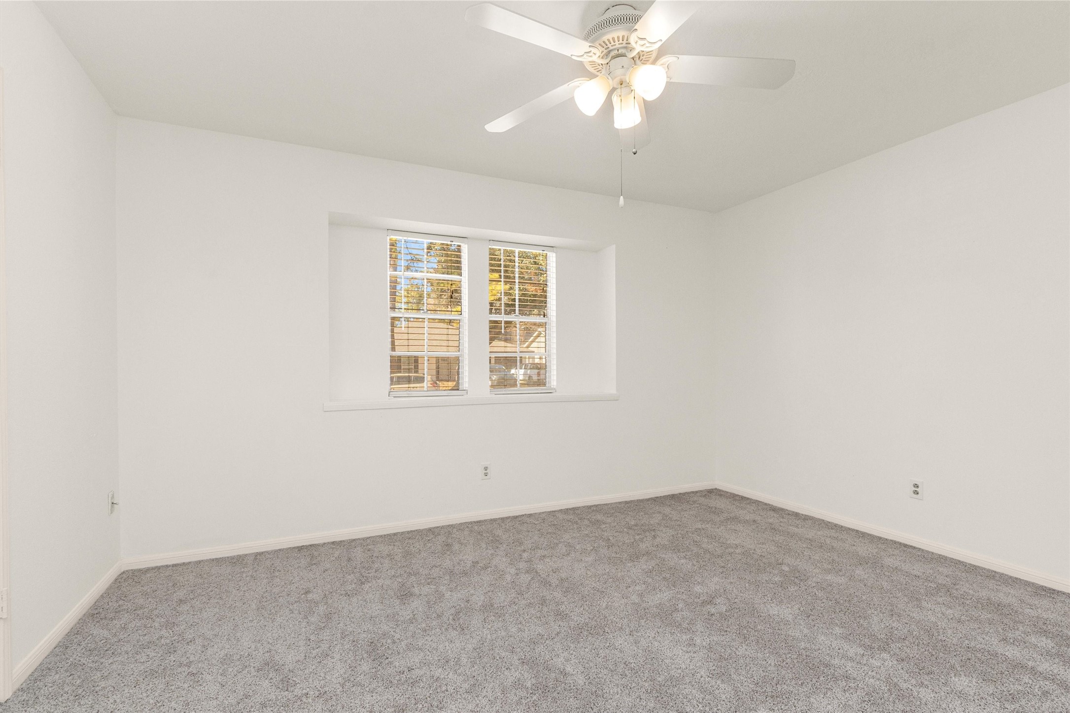 23014 Berry Pine Drive Spring, TX 77373 - Photo 22 of 29 Secondary bedroom located at the front of the home w/large window.