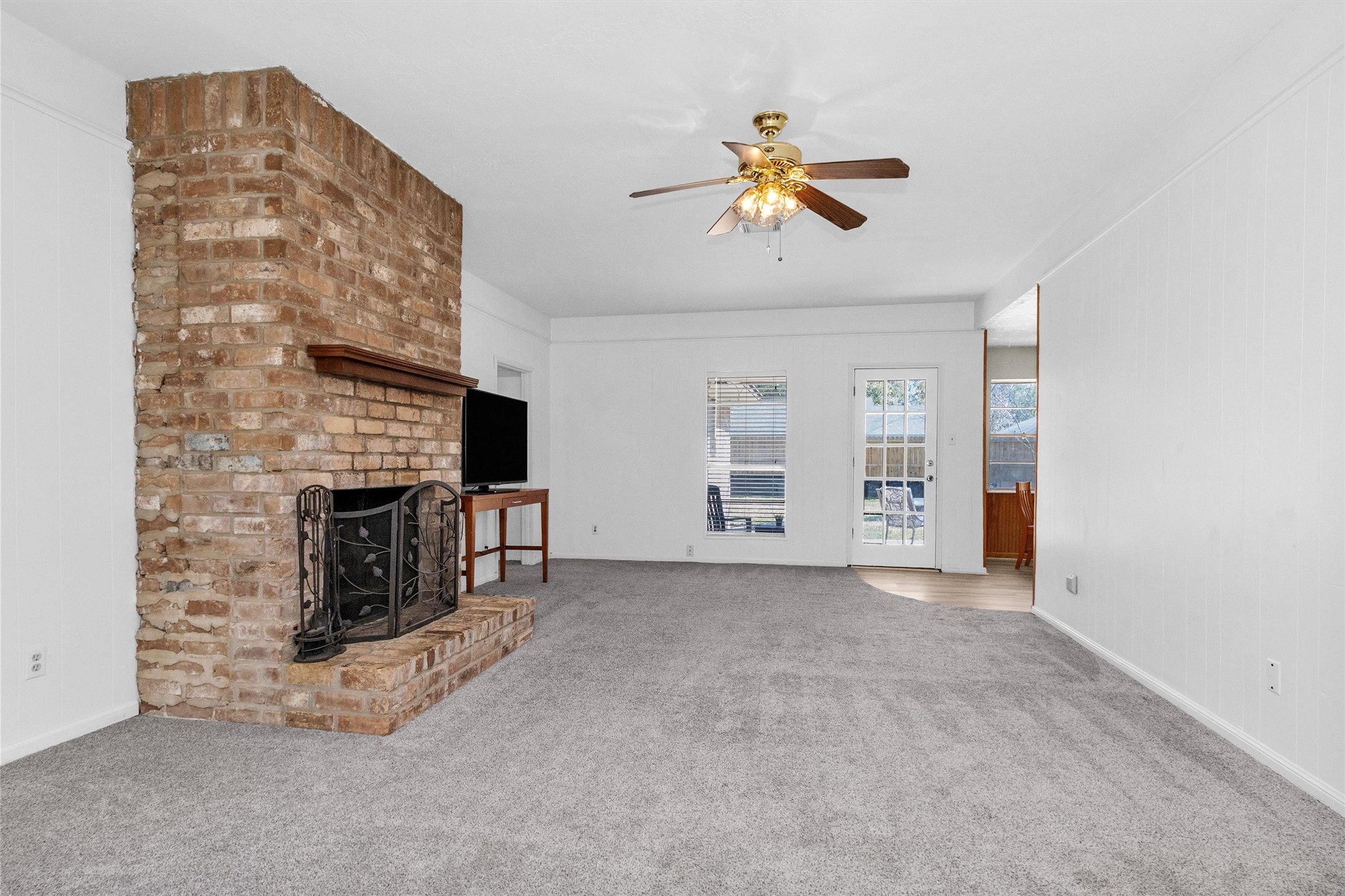 23014 Berry Pine Drive Spring, TX 77373 - Photo 6 of 29 Open famly room with cozy wood burning fireplace.