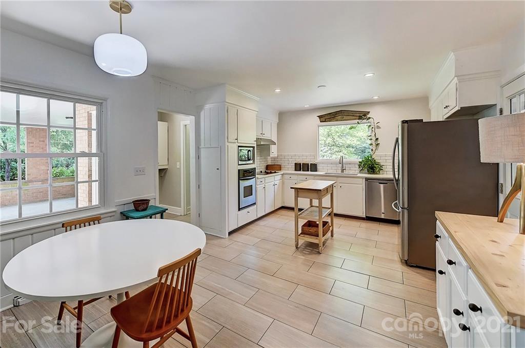 6119 Glenridge Road Charlotte, NC 28211 - Photo 12 of 41 a view of a dining room with furniture window and outside view