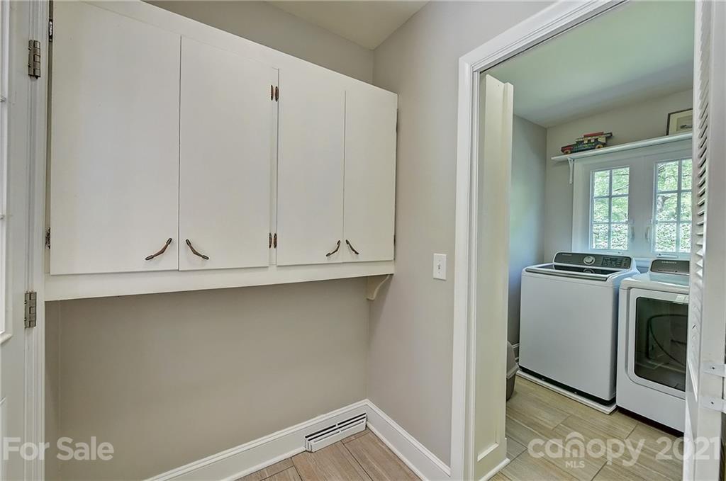 6119 Glenridge Road Charlotte, NC 28211 - Photo 17 of 41 a view of cabinets and utility room