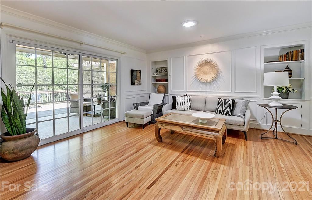 6119 Glenridge Road Charlotte, NC 28211 - Photo 19 of 41 a living room with furniture and a wooden floor