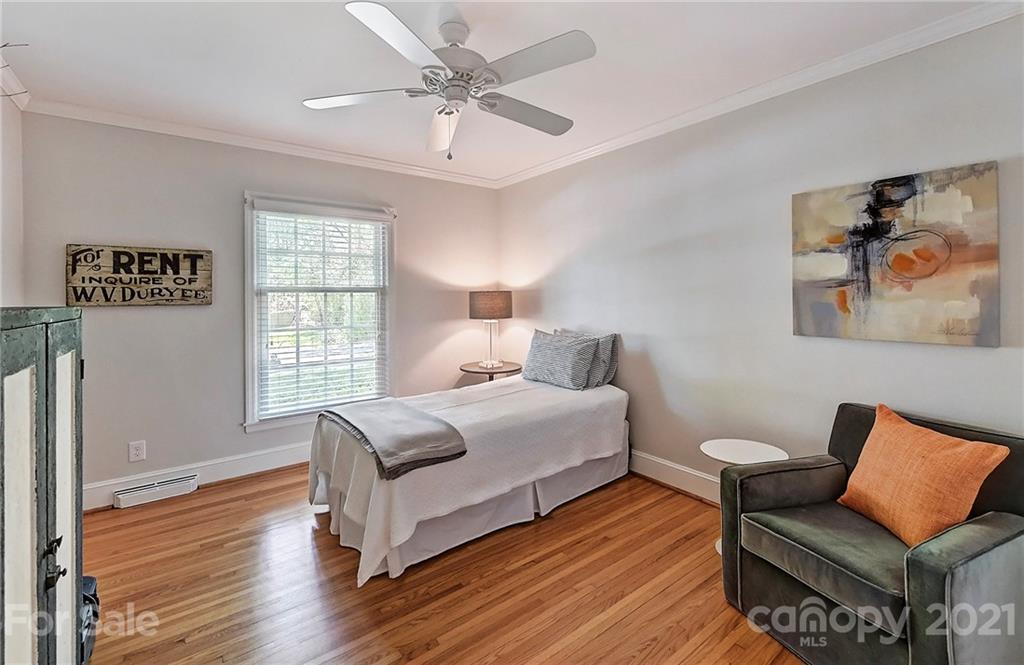6119 Glenridge Road Charlotte, NC 28211 - Photo 25 of 41 a bedroom with furniture and a large window