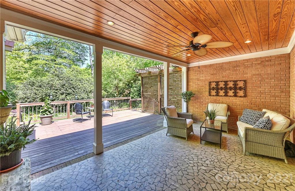 6119 Glenridge Road Charlotte, NC 28211 - Photo 29 of 41 a living room with furniture and a floor to ceiling window