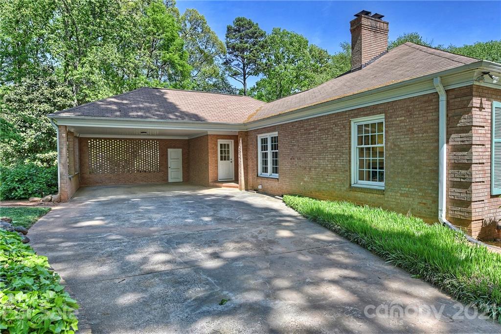 6119 Glenridge Road Charlotte, NC 28211 - Photo 40 of 41 a view of a house with a yard