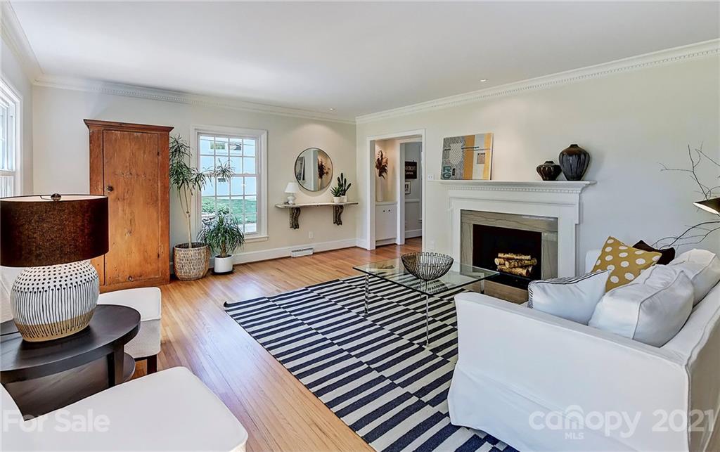 6119 Glenridge Road Charlotte, NC 28211 - Photo 5 of 41 a living room with furniture and a fireplace