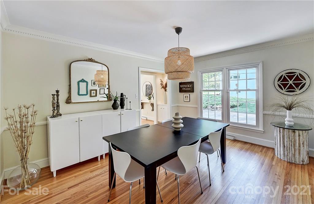 6119 Glenridge Road Charlotte, NC 28211 - Photo 9 of 41 a view of a dining room with furniture window and wooden floor