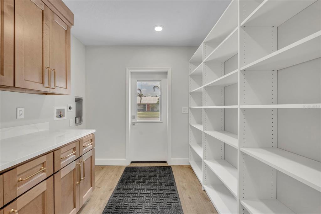 350 Cornwall Road Winter Park, FL 32792 - Photo 32 of 36 a kitchen with a cabinets and white appliances