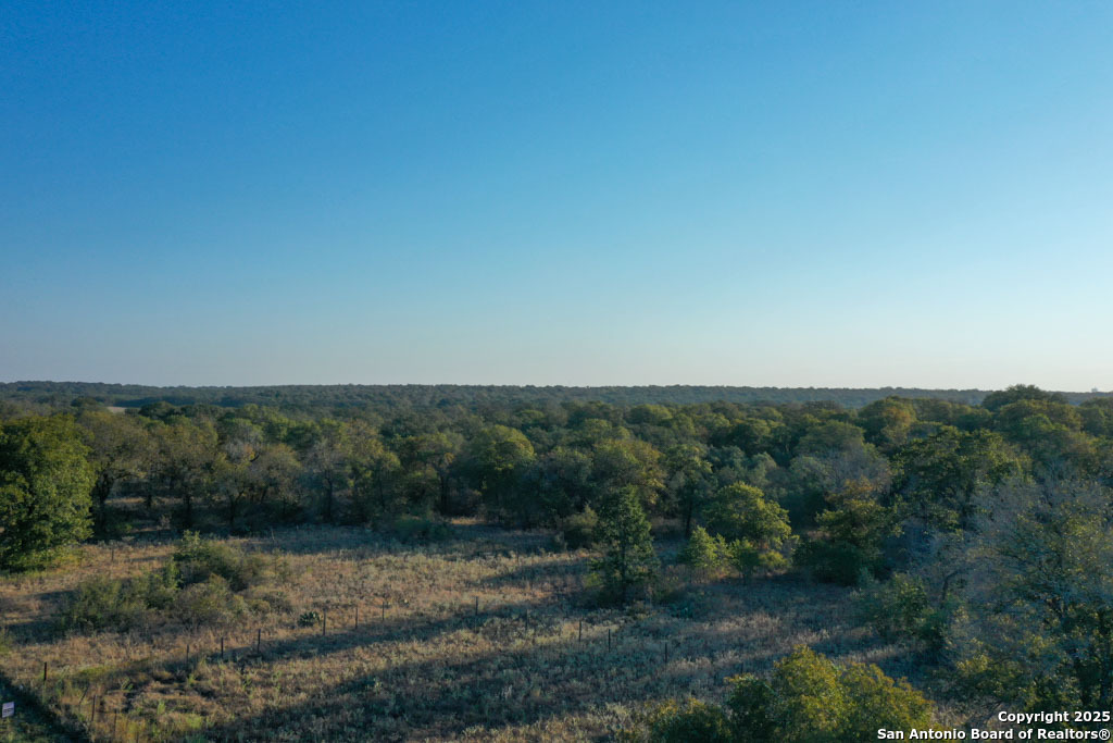 1830 Clear Lake Loop Poteet, TX 78065 - Photo 30 of 30 a view of a yard with an outdoor space