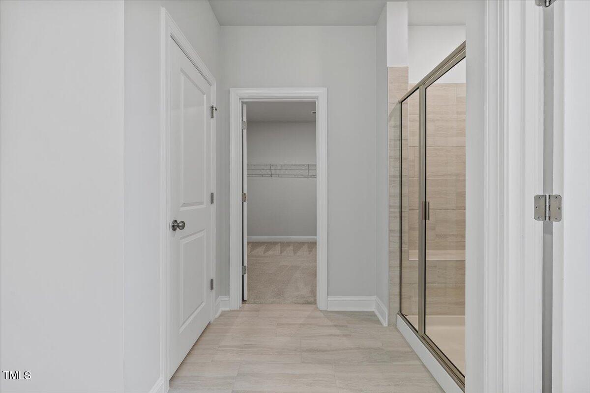 4716 Crescent Square Street, Unit 1314 Raleigh, NC 27616 - Photo 46 of 61 Entry to primary walk in closet off bathroom