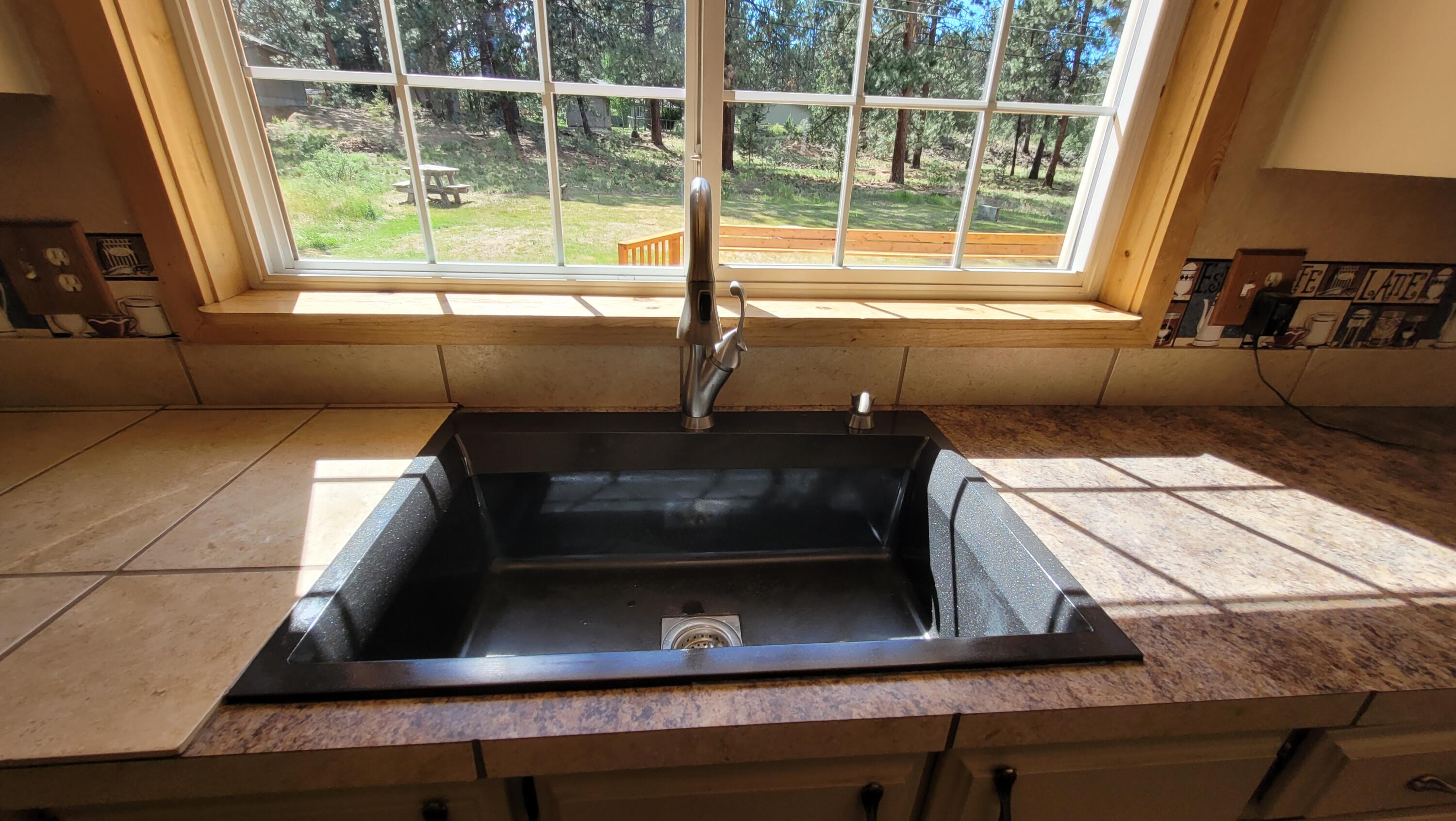 19724 Buck Canyon Road Bend, OR 97702 - Photo 15 of 38 Nice window view overlooking grounds.