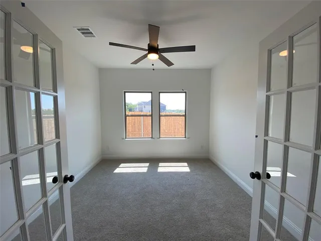 a view of empty room with windows