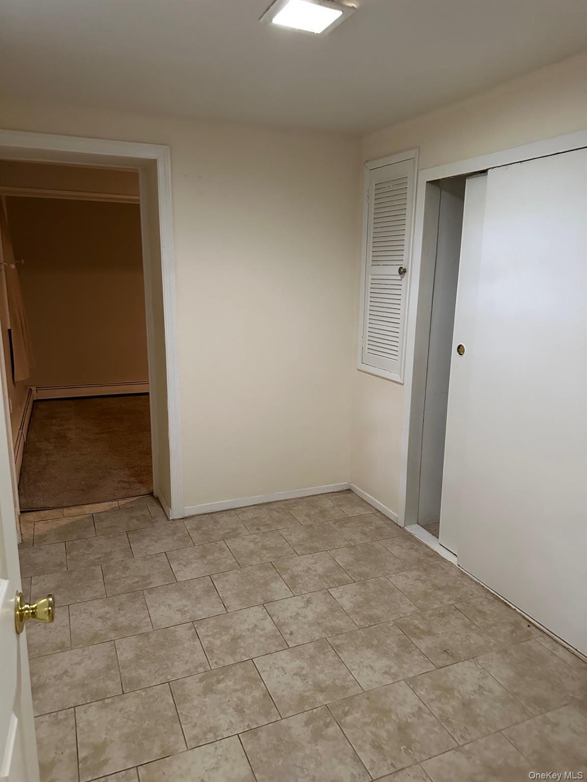 7 Yucca Road, Unit LOWR Rocky Point, NY 11778 - Photo 8 of 11 an empty room with closet