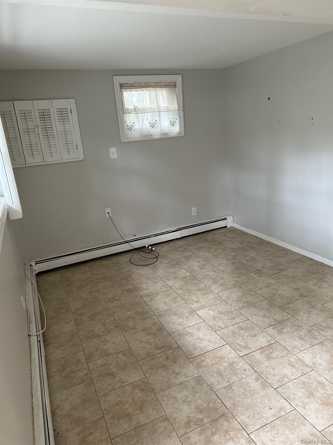 7 Yucca Road, Unit LOWR Rocky Point, NY 11778 - Photo 10 of 11 a view of an empty room