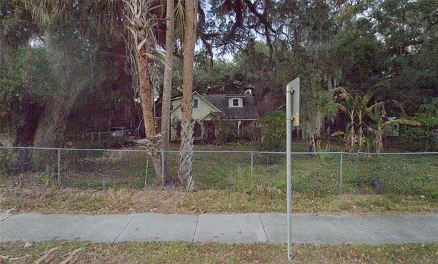 a backyard of a house with lots of green space
