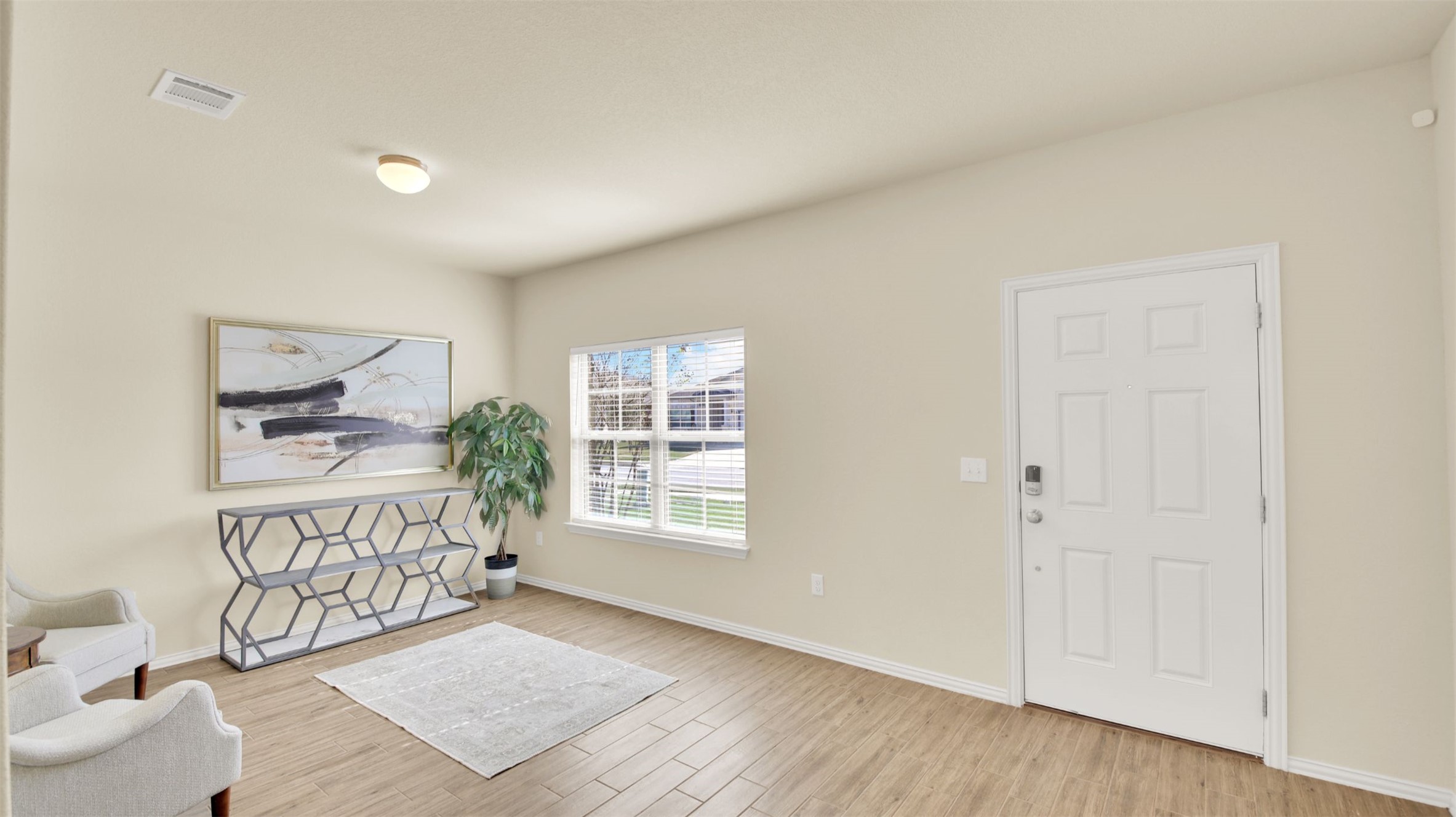 13716 Sugar Bush Path Manor, TX 78653 - Photo 11 of 37 Foyer entrance featuring baseboards and light wood finished floors